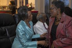 Two black women greeting