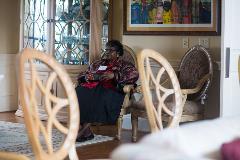 Photo of a woman sitting in a chair