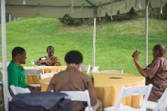 A group of people sitting at tables talking